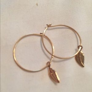 Mini gold-filled hoops with leaf charm from Etsy
